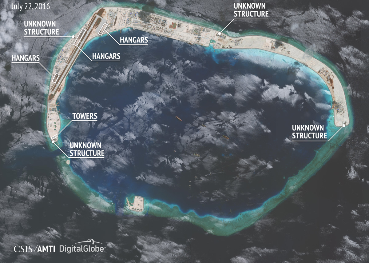 TQ xây trái phép hàng loạt nhà chứa chiến đấu cơ ở Trường Sa - Ảnh 2. TQ xây trái phép hàng loạt nhà chứa chiến đấu cơ ở Trường Sa - Ảnh 2.