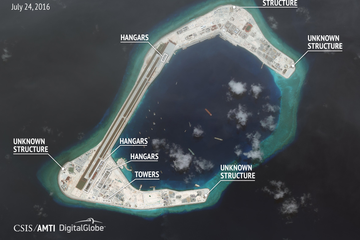 TQ xây trái phép hàng loạt nhà chứa chiến đấu cơ ở Trường Sa - Ảnh 1. TQ xây trái phép hàng loạt nhà chứa chiến đấu cơ ở Trường Sa - Ảnh 1.