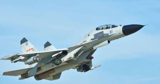 Tiêm kích Su-27 Trung Quốc chặn kích nguy hiểm máy bay P-8 Mỹ - Ảnh 1. Tiêm kích Su-27 Trung Quốc chặn kích nguy hiểm máy bay P-8 Mỹ - Ảnh 1.