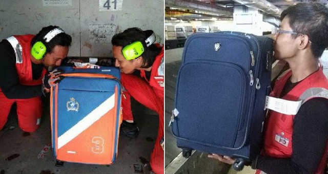 Nhân viên bốc xếp của AirAsia phải ôm, hôn từng chiếc vali sau khi bị tố quăng quật hành lý - Ảnh 1.