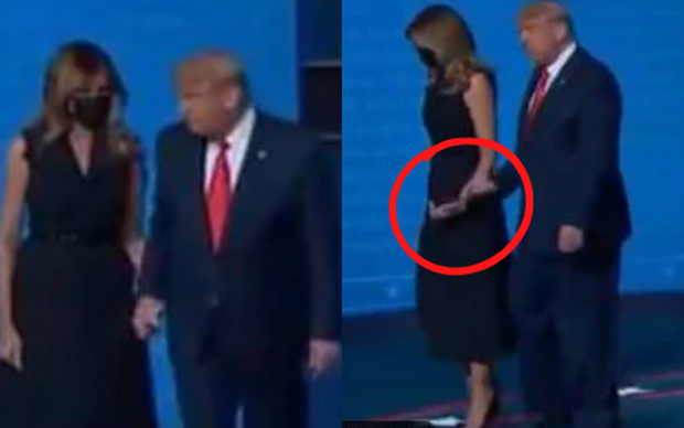 Tái xuất sau khi mắc Covid-19, Đệ Nhất Phu nhân Mỹ Melania Trump gây chú ý khi có hành động “giằng co” với chồng ngay trên sân khấu - Ảnh 3.