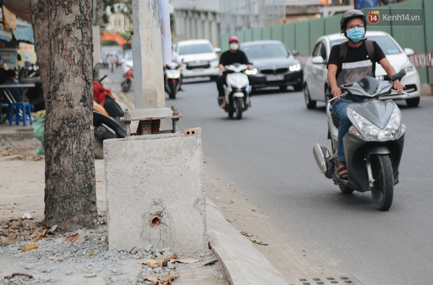 Nâng đường chống ngập ở Sài Gòn, nhà dân biến thành “hầm”: Mỗi lần chui ra chui vào lại đụng đầu, bỏ 100 triệu nâng nền - Ảnh 2.