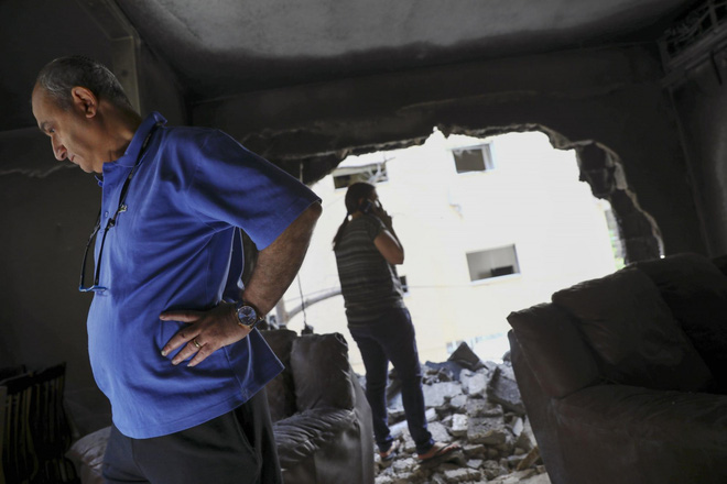 Loạt phóng rocket của Hamas đã tàn phá cơ sở hạ tầng và xe cộ Israel như thế nào? - Ảnh 11.