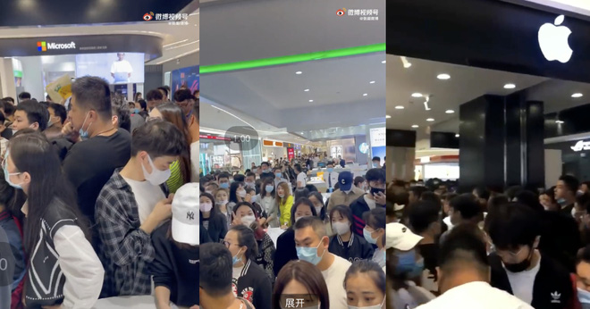 Đám đông hỗn loạn chen nhau để được xếp hàng mua iPhone 13 ở Trung Quốc. - Ảnh 3.
