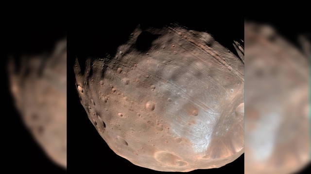 Các nhà khoa học phát hiện Sao Hỏa đang âm thầm xé toạc Mặt trăng lớn nhất - Ảnh 2.