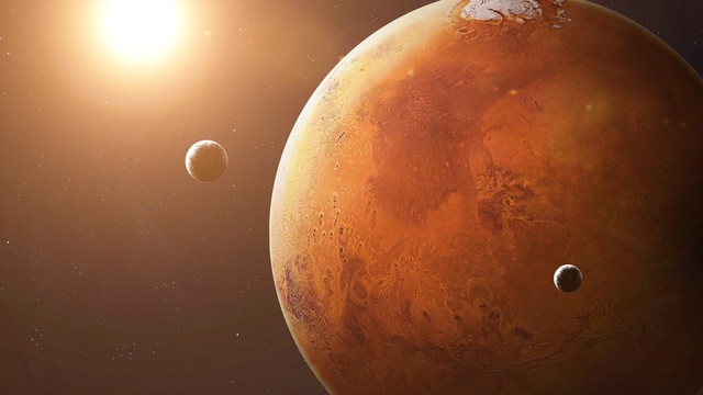 Các nhà khoa học phát hiện Sao Hỏa đang âm thầm xé toạc Mặt trăng lớn nhất - Ảnh 1.