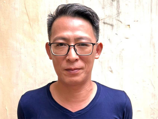 Cơ quan ANĐT Công an TP Hà Nội thực hiện lệnh bắt tạm giam đối với Nguyễn Lân Thắng - Ảnh 1.