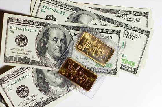 Giá vàng vượt mốc 69 triệu đồng/lượng, USD tiếp tục tăng mạnh - Ảnh 1.
