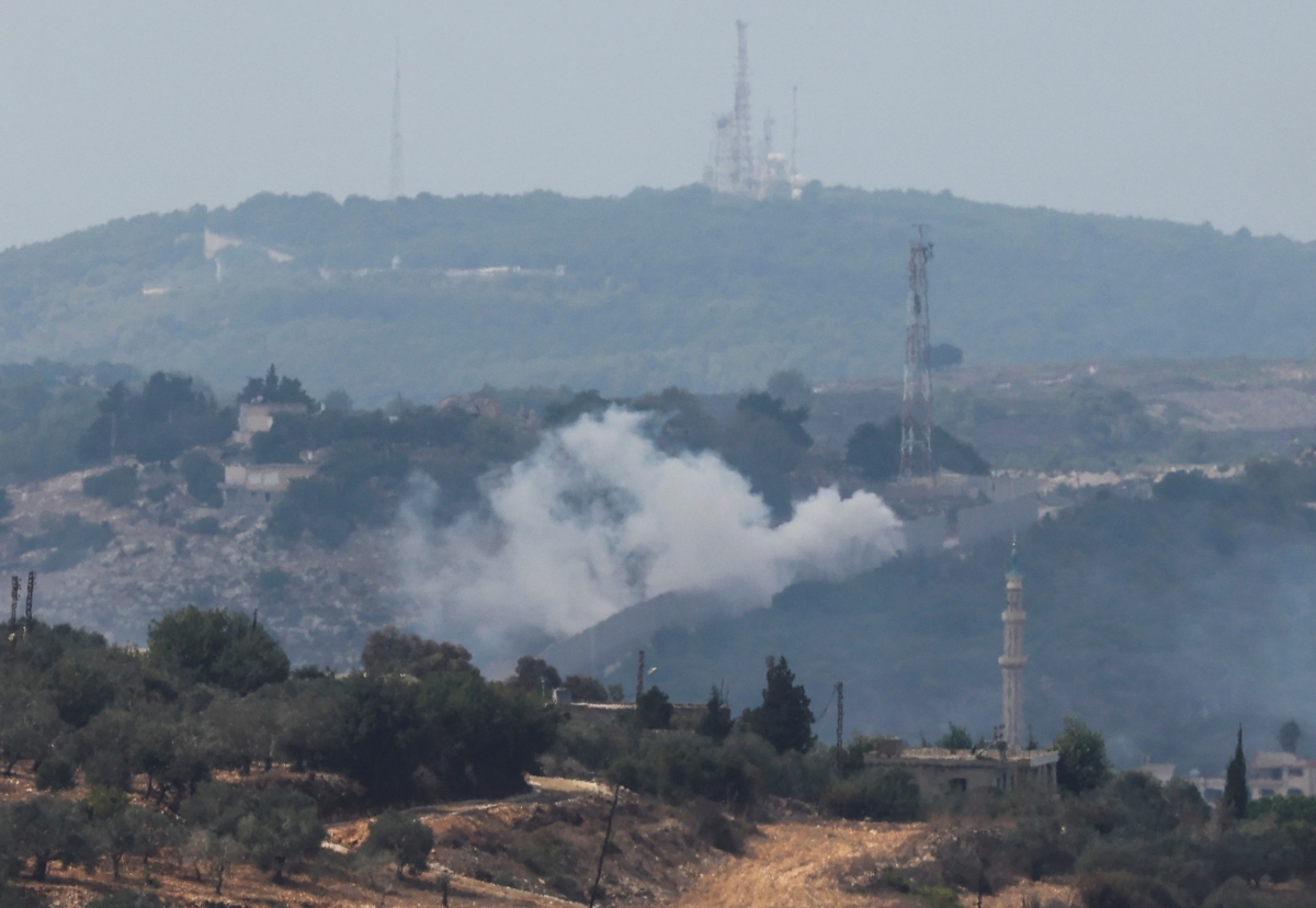 Hezbollah bắn hơn 60 quả tên lửa tấn công Israel- Ảnh 1.