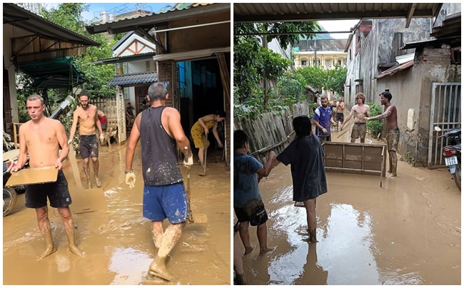 Thấy người phụ nữ Việt kêu "giúp tôi với", đoàn khách Tây lập tức lội bùn, xắn tay dọn dẹp sau lũ- Ảnh 2.