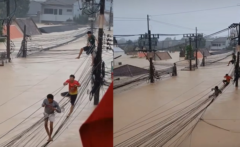 Lũ lịch sử ở Thái Lan: Người dân đu dây cáp, phá mái nhà thoát hiểm- Ảnh 1. Lũ lịch sử ở Thái Lan: Người dân đu dây cáp, phá mái nhà thoát hiểm- Ảnh 1.
