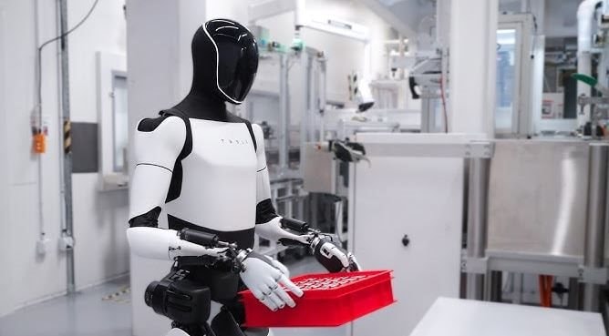 Bên Trong Phòng Thí Nghiệm Robot Của Tesla: Nhân Viên Phải Mặc Đồ Chuyên Biệt, Đeo Gần 20Kg Thiết Bị Trên Lưng Để Ghi Hình- Ảnh 2.