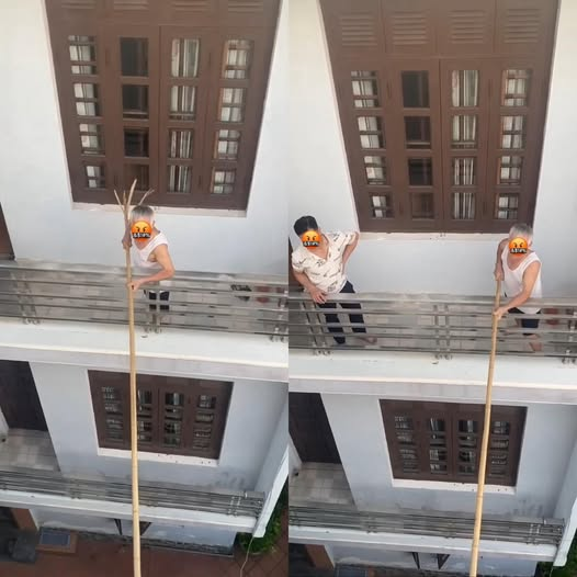 Người đàn ông dùng gậy dài ngăn hàng xóm mở cửa sổ: Ai đúng ai sai? - Ảnh 1. Người đàn ông dùng gậy dài ngăn hàng xóm mở cửa sổ: Ai đúng ai sai? - Ảnh 1.
