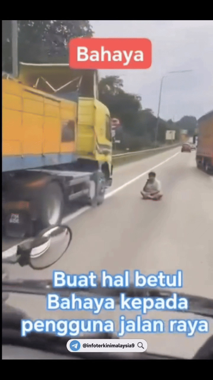 Tài xế xe tải dừng xe ở lề, ra ngồi giữa đường gây ùn tắc, ai đi qua cũng phải ngoái nhìn đầy khó hiểu - Ảnh 2.