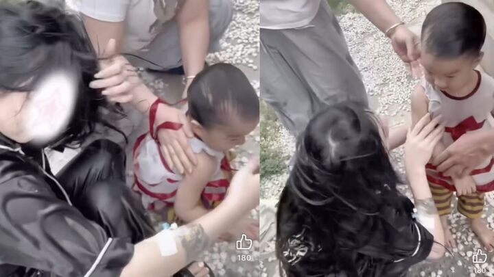 C&ocirc; g&aacute;i cứu em b&eacute; khỏi hồ c&aacute; d&ugrave; đang đeo ống truyền dịch g&acirc;y x&uacute;c động mạnh - Ảnh 1.