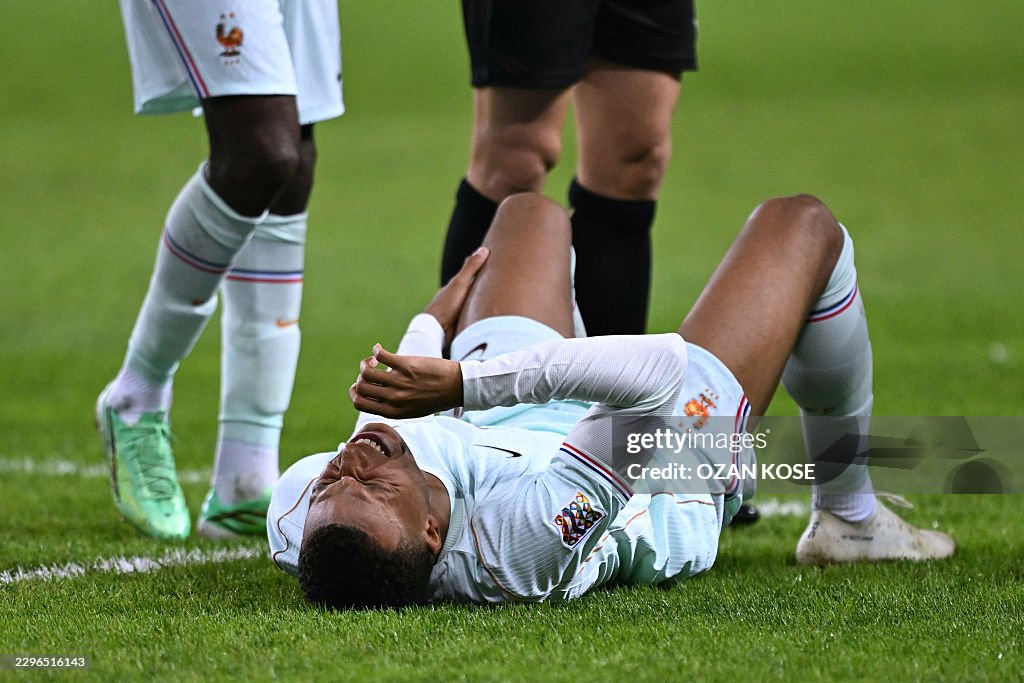 Mbappe chấn thương nặng ở tuyển Pháp , Real Madrid lo lắng 2026 - Ảnh 1. Mbappe chấn thương nặng ở tuyển Pháp , Real Madrid lo lắng 2026 - Ảnh 1.