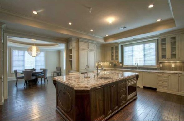 The kitchen looks into a dining area