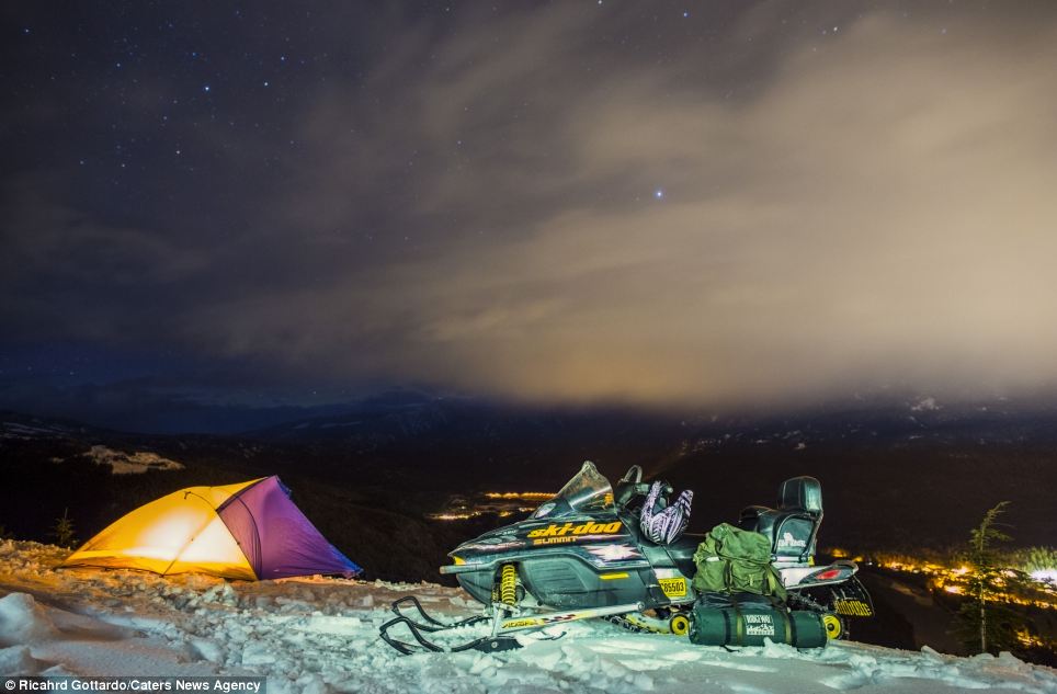 All weather endeavour: At the end of his trip, Mr Gottardo hired a snowmobile to make sure he could get the best view possible. he waited to see the Northern Lights for three months, before they could be photographed in April