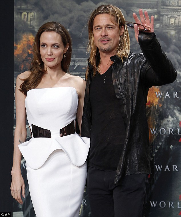 Back at her best: Angelina Jolie looked amazing in her white peplum dress as she arrived at the Berlin premiere of World War Z on Tuesday evening