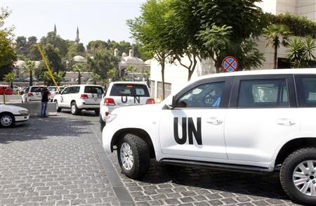 Đoàn xe chở các chuyên gia điều tra về vụ tấn công được cho có liên quan tới vũ khí hóa học ở Liên Hợp quốc. Ảnh: Reuters