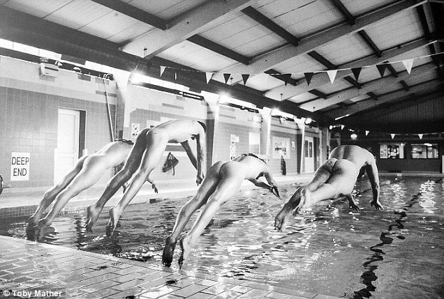 In the swim: The swimming team chose to be pictured diving naked into the University poo