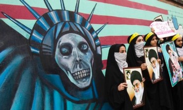 Iranian students stand in front of former US embassy in Tehran, November 4, 2011.