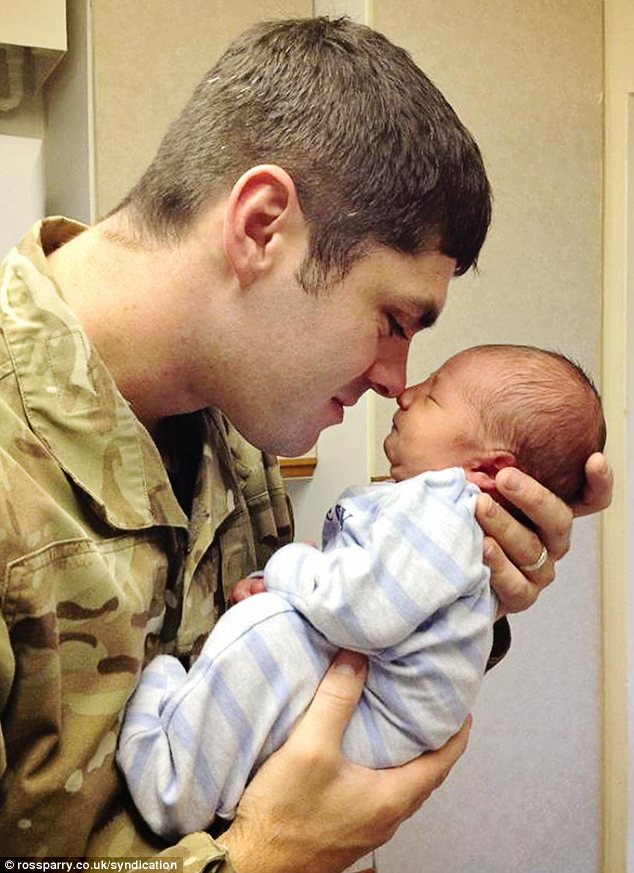 Emotion: The image for July shows one-day-old Jack Butlin with his father, who was about to go to Afghanistan