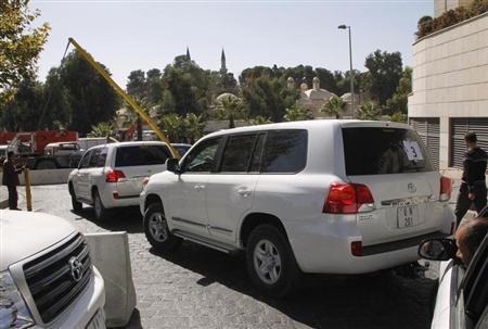 
	Xe LHQ chở nhóm chuyên gia OPCW rời khách sạn ở Damascus ngày 22/10/2013