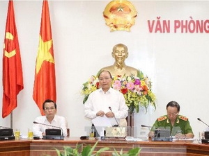 Phó Thủ tướng Nguyễn Xuân Phúc tại buổi làm việc (Ảnh: TTXVN)