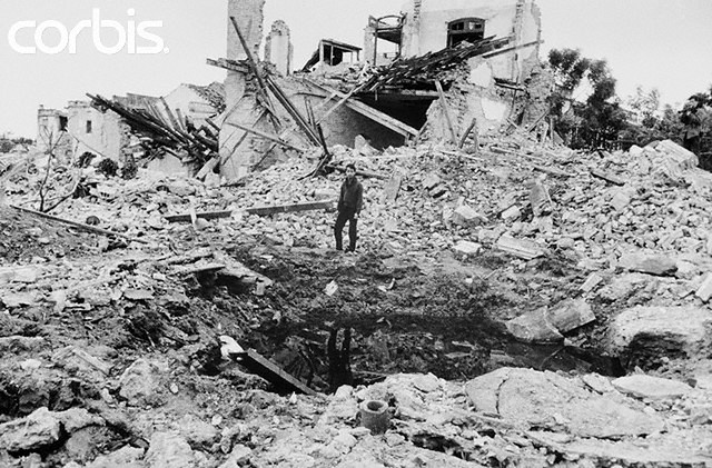 March 9, 1968, Haiphong, North Vietnam --- Rubble. Haiphong, North Vietnam: This sign with the bomb (foreground) in downtown Haiphong, indicates that there are still unexploded bombs in the area and that it is off limits after US air raids. Photo was made in Haiphong by Nippon Depna News and released in Tokyo, March 9. ca. March 9 1968. --- Image by © Bettmann/CORBIS