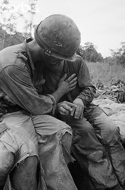 25 May 1967, Pleiku, Vietnam --- Pleiku, South Vietnam:An unidentified soldier breaks down under the stress of combat and is comforted by a comrade following recent battle 55 miles west of Pleiku. Troops of the US 4th Infantry Division engaged a force of North Vietnam regulars near the Cambodian border. 5/25/1967 --- Image by © Bettmann/CORBIS
