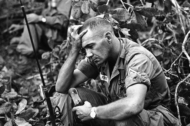 The strain of battle for Dong Xoai is shown on the face of U.S. Army Sgt. Philip Fink, an advisor to the 52nd Vietnamese Ranger battalion, shown June 12, 1965. The unit bore the brunt of recapturing the jungle outpost from the Viet Cong. (AP Photo/Steve Stibbens