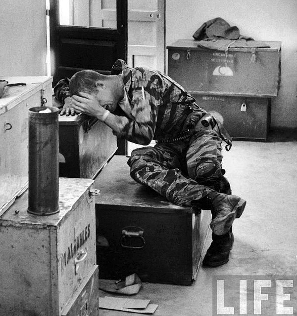 Lance corporal James C. Farley breaking down in tears over the death of fellow soldiers after a confrontation with Viet Cong, Vietnam, March 31, 1965.