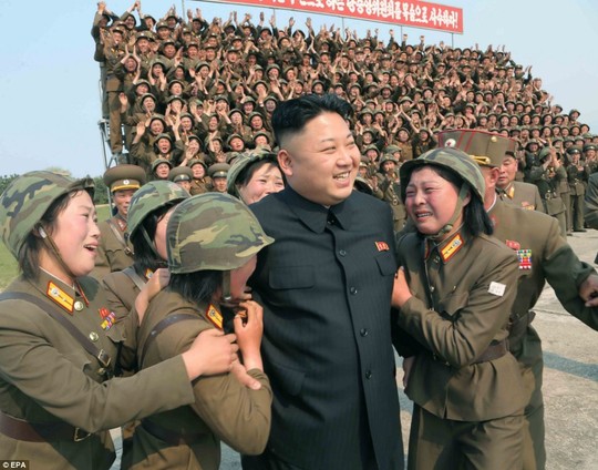 Ladies man: An undated picture released on Thursday shows North Korean leader Kim Jong-un surrounded by soldiers at a womens artillery unit in North Koreas southeastern province of Kangwon