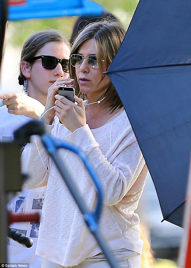 In the zone: Jen looked very focused on set on Monday