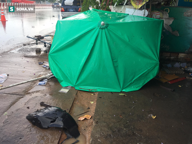 Truy tìm ô tô tông tử vong người phụ nữ đang dọn hàng lúc trời mưa - Ảnh 2.