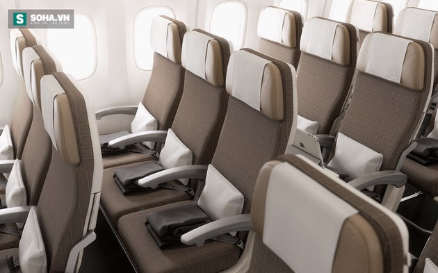 Vì sao ghế ngồi trên máy bay thường không thẳng hàng với cửa sổ? - Ảnh 1.
