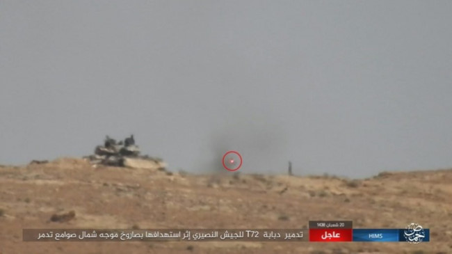 Quân đội Syria dội bão lửa thiêu đốt IS trên chiến trường Palmyra - Ảnh 1.