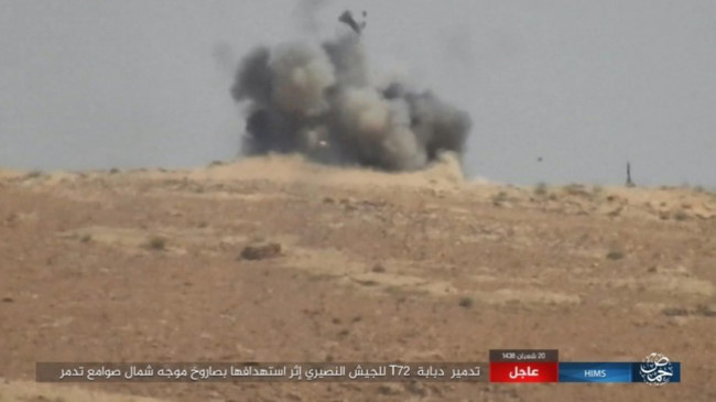 Quân đội Syria dội bão lửa thiêu đốt IS trên chiến trường Palmyra - Ảnh 2.