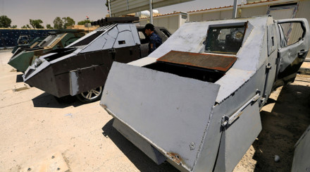 Mục sở thị những chiếc “xe bọc thép” tự chế kỳ dị của IS ở Mosul - Ảnh 1.