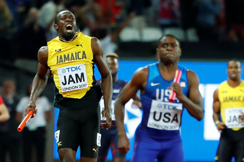 Usain Bolt chấn thương, lê lết về đích ở lần chạy cuối cùng trong sự nghiệp - Ảnh 1.