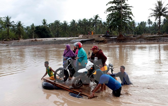 [Photo] Bão Tembin tàn phá, gây ngập lụt khắp nơi tại Philippines - Ảnh 1.