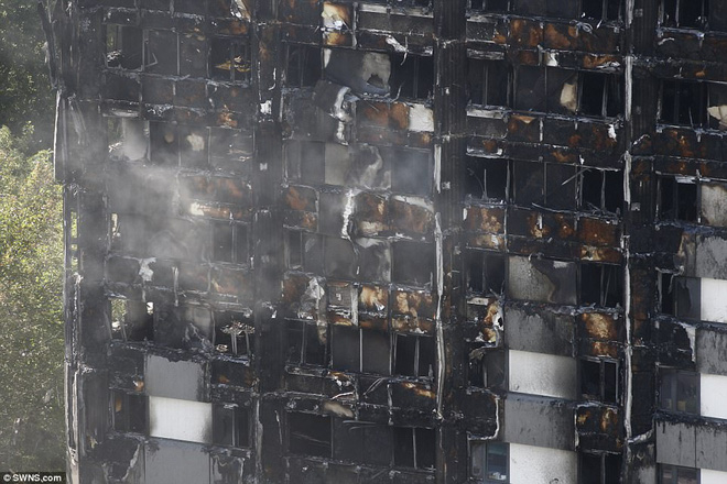 Những hình ảnh đầu tiên cho thấy khung cảnh hoang tàn bên trong tòa tháp 24 tầng sau vụ hỏa hoạn nghiêm trọng - Ảnh 5.