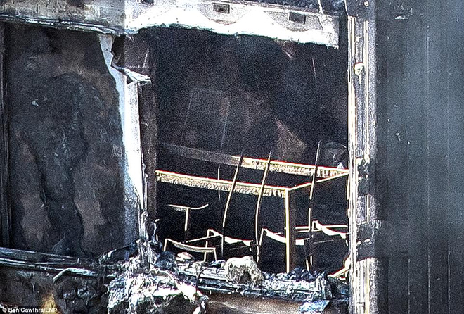 Những hình ảnh đầu tiên cho thấy khung cảnh hoang tàn bên trong tòa tháp 24 tầng sau vụ hỏa hoạn nghiêm trọng - Ảnh 6.
