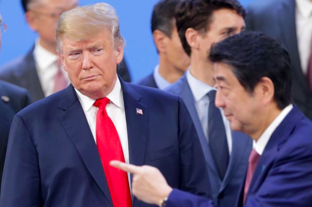 2018: 8 lần TT Trump tấn công tinh hoa thế giới, từ Vladimir Putin tới Angela Merkel… - Ảnh 2. 2018: 8 lần TT Trump tấn công tinh hoa thế giới, từ Vladimir Putin tới Angela Merkel… - Ảnh 2.