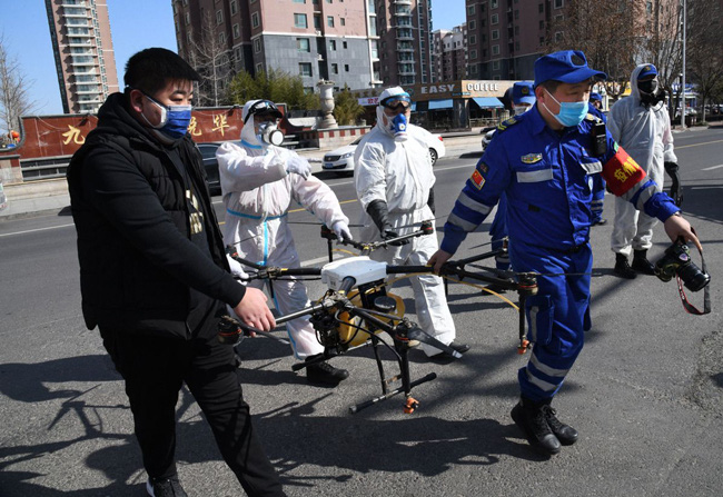 Trung Quốc sử dụng máy bay không người lái đối phó với virus corona - Ảnh 4.