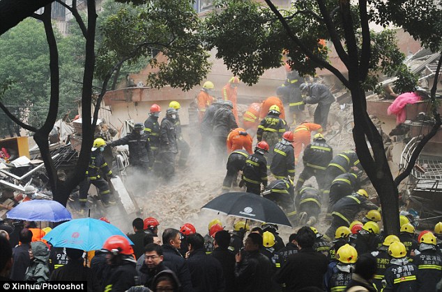 Hoping for the best: The exact number of casualties is unknown at this time as rescuers comb the debris