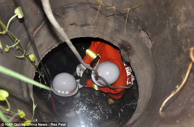 Rescue: Huang Wei was eventually found by a morning jogger who heard his cries from inside the well at 7.25am the following morning 