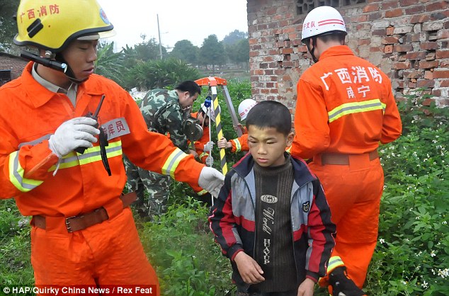 Lucky escape: Huang Wei was left with a black eye and some bruises but no serious injuries 