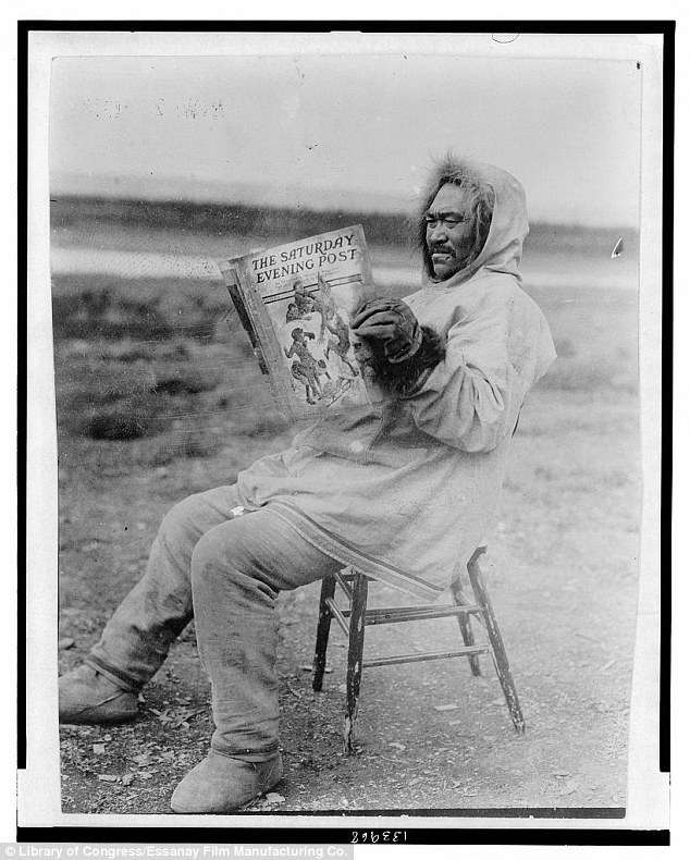 Leisure time: A man sits back in a frozen field while reading a copy of the Saturday Evening Post in 1913